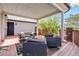 Relaxing covered patio with comfortable seating and views of the surrounding landscape at 7388 S Ireland Cir, Centennial, CO 80016