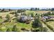 Charming two-story home with a spacious backyard, featuring a deck, mature trees, and beautiful landscaping at 7388 S Ireland Cir, Centennial, CO 80016