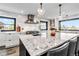 Kitchen with a large island, stainless steel appliances, and a view to the outside at 7388 S Ireland Cir, Centennial, CO 80016