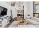 Inviting living room featuring stylish furnishings, decor, and a view into the eat-in kitchen at 7388 S Ireland Cir, Centennial, CO 80016