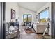 Bright living room featuring vaulted ceilings, modern decor, a telescope, and a comfortable seating area at 7388 S Ireland Cir, Centennial, CO 80016