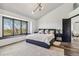 Spacious main bedroom with a large window, vaulted ceiling, and stylish decor at 7388 S Ireland Cir, Centennial, CO 80016