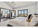 Bright main bedroom with a window seat, a comfortable bed, and an open layout at 7388 S Ireland Cir, Centennial, CO 80016