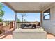 Comfortable covered patio with seating offering relaxing outdoor space and neighborhood views at 7388 S Ireland Cir, Centennial, CO 80016