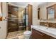 Modern bathroom with beautiful mosaic tiles, rainfall shower head and glass shower doors at 209 American Way, Breckenridge, CO 80424