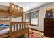 Bedroom with bunk beds, natural light, and colorful decor at 209 American Way, Breckenridge, CO 80424