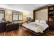 Cozy bedroom features a Murphy bed, hardwood floors, and a large window for natural light at 209 American Way, Breckenridge, CO 80424