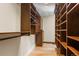 Walk-in closet with custom wood shelving, wood floors and ample storage space for clothes and accessories at 209 American Way, Breckenridge, CO 80424