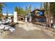 Beautiful home with modern design, wood accents, and a well-maintained driveway at 209 American Way, Breckenridge, CO 80424