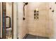 Shower with stylish tile, glass doors, dark fixtures, and a built-in niche at 209 American Way, Breckenridge, CO 80424