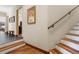 Staircase featuring wood steps, a decorative rope railing, and an artful accent piece on the wall at 209 American Way, Breckenridge, CO 80424