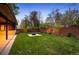 Spacious backyard featuring a lush lawn and fire pit at 424 Grape St, Denver, CO 80220