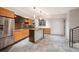 Entertain in this home bar area featuring a refrigerator, cabinets, bar island, and shelving at 424 Grape St, Denver, CO 80220