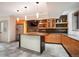 Entertain in this home bar area featuring a refrigerator, cabinets, bar island, and shelving at 424 Grape St, Denver, CO 80220