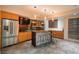 Stylish bar area with wood countertops, ample cabinetry, and a stainless-steel refrigerator at 424 Grape St, Denver, CO 80220