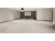 This basement features carpet flooring, ample space, and a projector screen at 424 Grape St, Denver, CO 80220