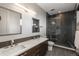 Contemporary bathroom featuring double vanity, modern fixtures, and glass enclosed shower at 424 Grape St, Denver, CO 80220