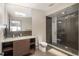 Sleek bathroom featuring a glass-enclosed shower, a modern vanity, and minimalist design elements at 424 Grape St, Denver, CO 80220