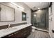 Modern bathroom with double sinks and walk-in glass shower at 424 Grape St, Denver, CO 80220