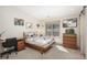 Bedroom features a desk, bed, and window with natural light at 424 Grape St, Denver, CO 80220