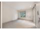 A bright and airy bedroom shows neutral paint, carpet and trim, and a barn door at 424 Grape St, Denver, CO 80220