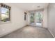 Bright bedroom with large windows and door to deck at 424 Grape St, Denver, CO 80220