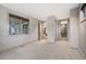 Carpeted bedroom with access to other rooms and bright windows at 424 Grape St, Denver, CO 80220