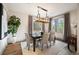 Bright dining room with large windows and a modern chandelier at 424 Grape St, Denver, CO 80220