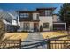 Modern two-story home showcasing a manicured lawn and stone walkway leading to the front entrance at 424 Grape St, Denver, CO 80220