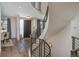 Elegant foyer with spiral staircase, hardwood floors, and a modern front door, creating a welcoming entrance at 424 Grape St, Denver, CO 80220