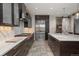 Modern kitchen featuring stainless steel appliances, a kitchen island and tile flooring at 424 Grape St, Denver, CO 80220