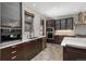 Gourmet kitchen featuring stainless steel appliances, marble countertops, and dark wood cabinetry at 424 Grape St, Denver, CO 80220