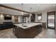 Spacious open concept kitchen with island, marble countertops, and pendant lighting at 424 Grape St, Denver, CO 80220