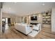 Spacious living room features a stone fireplace and hardwood floors at 424 Grape St, Denver, CO 80220