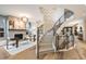 Inviting living room with a fireplace and a curved staircase at 424 Grape St, Denver, CO 80220