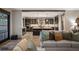 Open-concept living room and kitchen with modern decor and ample natural light at 424 Grape St, Denver, CO 80220