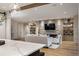Stylish living room with stone fireplace, open shelving, hardwood floors, and kitchen access at 424 Grape St, Denver, CO 80220