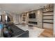 Comfortable living room showcasing a stone fireplace, sleek furniture, and open layout, ideal for modern living at 424 Grape St, Denver, CO 80220