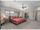 Bright main bedroom featuring a platform bed, ceiling fan, and large windows at 424 Grape St, Denver, CO 80220