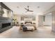 Serene main bedroom with fireplace, large windows, and comfortable furnishings at 424 Grape St, Denver, CO 80220