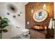 Chic powder room with a unique copper vessel sink and accent wall at 424 Grape St, Denver, CO 80220
