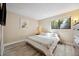 Bright bedroom with hardwood floors, closet, and a large window at 12354 W Nevada Pl # 102, Lakewood, CO 80228