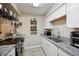 Well-lit kitchen features granite countertops, modern appliances, and ample cabinet space at 12354 W Nevada Pl # 102, Lakewood, CO 80228