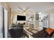Open living area with bar seating and view into updated kitchen at 12354 W Nevada Pl # 102, Lakewood, CO 80228
