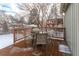 Relax on this back deck with wood flooring, partial enclosure, and outdoor furniture at 6526 S Cherry Way, Centennial, CO 80121