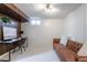 Finished basement with wood paneling, white walls, a workstation, and a leather sofa at 6526 S Cherry Way, Centennial, CO 80121