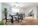 Inviting dining room featuring natural light, wood floors, and a stylish table setting with seating for four at 6526 S Cherry Way, Centennial, CO 80121