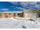 Charming single-Gathering home featuring a well-maintained lawn, attached garage, and classic brick accents at 6526 S Cherry Way, Centennial, CO 80121