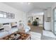 Cozy living room seamlessly connected to a modern kitchen with a large island and stainless steel appliances at 6526 S Cherry Way, Centennial, CO 80121