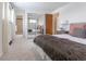 Comfortable main bedroom featuring plush carpet, a mirrored closet, and neutral decor at 6526 S Cherry Way, Centennial, CO 80121